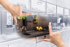 Female hands framing custom kitchen design. Combination drawing and photo.